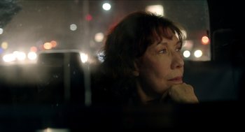 Movie still from “Grandma” (2015), directed by Paul Weitz – A woman sitting in a car at night looking out the window; Close Up shot, Low angle