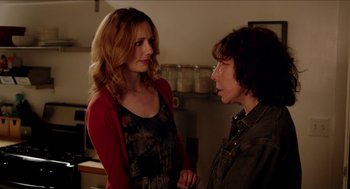 Movie still from “Grandma” (2015), directed by Paul Weitz – Two women standing next to each other in a kitchen; Medium shot, Over the shoulder angle