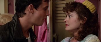 Movie still from “Grease 2” (1982), directed by Patricia Birch – A man and a woman face to face in front of a mirror; Close Up shot, Over the shoulder angle