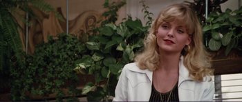 Movie still from “Grease 2” (1982), directed by Patricia Birch – A woman with blonde hair wearing a white jacket; Close Up shot, Low angle