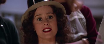 Movie still from “Grease 2” (1982), directed by Patricia Birch – A person wearing a hat; Close Up shot, Low angle