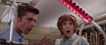 Movie still from “Grease 2” (1982), directed by Patricia Birch – A man and a woman talking to each other; Close Up shot, Low angle