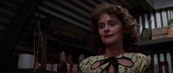 Movie still from “Grease 2” (1982), directed by Patricia Birch – A person with curly hair wearing a dress; Close Up shot, Low angle