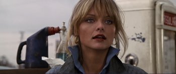Movie still from “Grease 2” (1982), directed by Patricia Birch – A person wearing a blue shirt; Close Up shot, Low angle