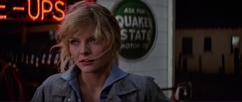 Movie still from “Grease 2” (1982), directed by Patricia Birch – A person wearing a jacket; Close Up shot, Over the shoulder angle