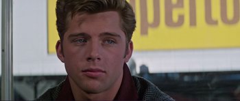 Movie still from “Grease 2” (1982), directed by Patricia Birch – A man's face in a movie scene; Close Up shot, Over the shoulder angle
