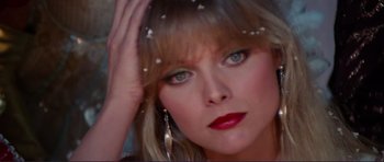 Movie still from “Grease 2” (1982), directed by Patricia Birch – A person wearing a dress; Close Up shot, High angle