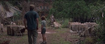 Movie still from “Great Expectations” (1998), directed by Alfonso Cuarón – A man and a child looking at a statue; Wide shot, Over the shoulder angle