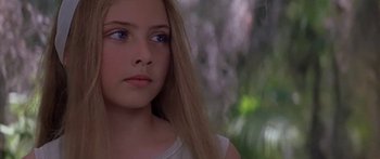 Movie still from “Great Expectations” (1998), directed by Alfonso Cuarón – A young girl with long blonde hair and blue eyes; Close Up shot, Over the shoulder angle