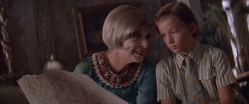 Movie still from “Great Expectations” (1998), directed by Alfonso Cuarón – An older woman sitting next to a young boy; Close Up shot, Over the shoulder angle