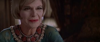 Movie still from “Great Expectations” (1998), directed by Alfonso Cuarón – An older woman wearing a green dress and a necklace; Close Up shot, Low angle