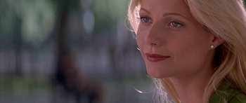 Movie still from “Great Expectations” (1998), directed by Alfonso Cuarón – A woman's face with a blurry background; Close Up shot, Over the shoulder angle