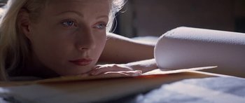 Movie still from “Great Expectations” (1998), directed by Alfonso Cuarón – A person laying on a bed; Close Up shot, Low angle