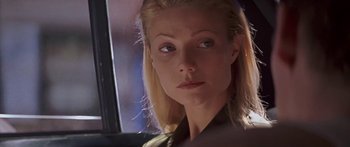 Movie still from “Great Expectations” (1998), directed by Alfonso Cuarón – A person with blonde hair and blue eyes; Close Up shot, Over the shoulder angle