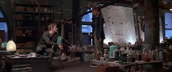 Movie still from “Great Expectations” (1998), directed by Alfonso Cuarón – A man and a woman are in a room with art supplies; Wide shot, Over the shoulder angle