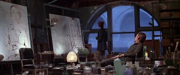 Movie still from “Great Expectations” (1998), directed by Alfonso Cuarón – A man standing in front of an easel in a room; Wide shot, Low angle
