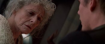 Movie still from “Great Expectations” (1998), directed by Alfonso Cuarón – An older woman with blonde hair looking into a mirror; Close Up shot, Low angle