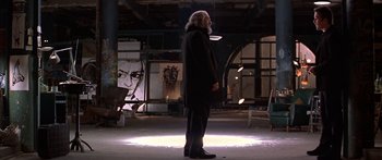 Movie still from “Great Expectations” (1998), directed by Alfonso Cuarón – A man standing in a room with a painting in the background; Wide shot, Low angle