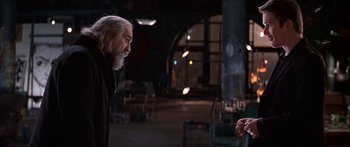 Movie still from “Great Expectations” (1998), directed by Alfonso Cuarón – An older man is talking to a younger man; Medium shot, Over the shoulder angle