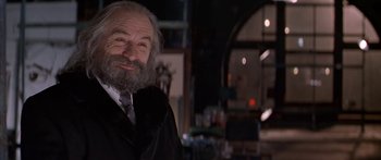 Movie still from “Great Expectations” (1998), directed by Alfonso Cuarón – An old man with a beard and a suit; Close Up shot, Low angle