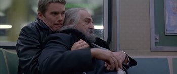 Movie still from “Great Expectations” (1998), directed by Alfonso Cuarón – Two men sitting next to each other on a train; Close Up shot, Low angle