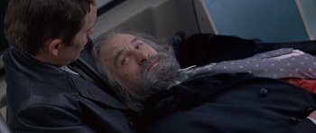 Movie still from “Great Expectations” (1998), directed by Alfonso Cuarón – An older man with a beard and a tie; Close Up shot, Low angle