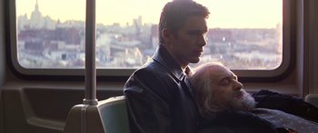 Movie still from “Great Expectations” (1998), directed by Alfonso Cuarón – A man in a leather jacket looking out of a window; Close Up shot, Over the shoulder angle