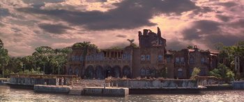 Movie still from “Great Expectations” (1998), directed by Alfonso Cuarón – An abandoned building with a cloudy sky in the background; Extreme Wide shot, Low angle