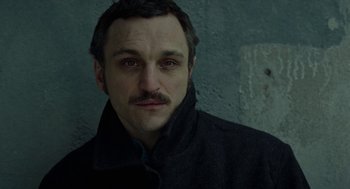 Movie still from “Great Freedom” (2021), directed by Sebastian Meise – A person wearing a jacket; Close Up shot, High angle