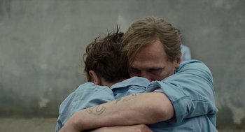 Movie still from “Great Freedom” (2021), directed by Sebastian Meise – A man and a woman hugging each other; Close Up shot, Over the shoulder angle