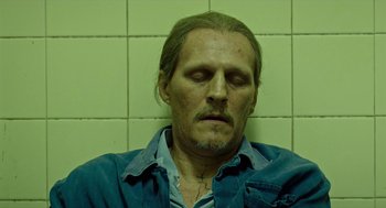 Movie still from “Great Freedom” (2021), directed by Sebastian Meise – A person with his eyes closed; Close Up shot, High angle