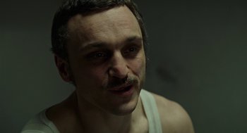 Movie still from “Great Freedom” (2021), directed by Sebastian Meise – A person with a mustache; Close Up shot, High angle