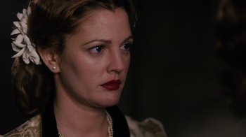 Movie still from “Grey Gardens” (2009), directed by Michael Sucsy – A person wearing a necklace; Close Up shot, Over the shoulder angle