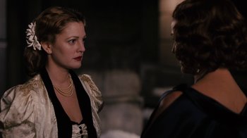 Movie still from “Grey Gardens” (2009), directed by Michael Sucsy – A woman in a black and white dress talking to a man in a black suit; Close Up shot, Over the shoulder angle