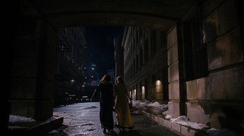 Movie still from “Grey Gardens” (2009), directed by Michael Sucsy – Two people walking down a street at night; Extreme Wide shot, High angle