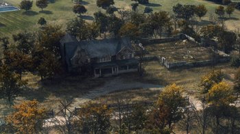 Movie still from “Grey Gardens” (2009), directed by Michael Sucsy – An aerial view of an old house in the middle of a field; Extreme Wide shot, High angle