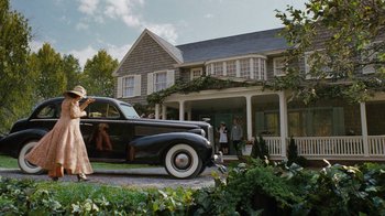 Movie still from “Grey Gardens” (2009), directed by Michael Sucsy – An old car parked in front of a house; Wide shot, Low angle