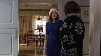 Movie still from “Grey Gardens” (2009), directed by Michael Sucsy – A woman in a blue dress and a woman in a white hat; Medium shot, Over the shoulder angle