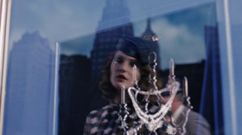 Movie still from “Grey Gardens” (2009), directed by Michael Sucsy – A woman is standing in front of a window with a chandelier; Close Up shot, Low angle