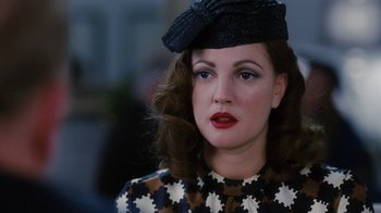 Movie still from “Grey Gardens” (2009), directed by Michael Sucsy – A person wearing a hat; Close Up shot, Over the shoulder angle