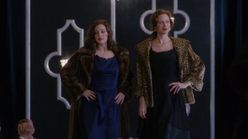 Movie still from “Grey Gardens” (2009), directed by Michael Sucsy – A couple of women standing next to each other; Medium shot, Low angle