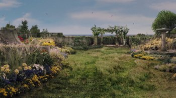 Movie still from “Grey Gardens” (2009), directed by Michael Sucsy – An image of an outdoor setting with flowers; Extreme Wide shot, High angle