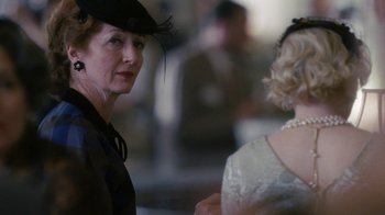 Movie still from “Grey Gardens” (2009), directed by Michael Sucsy – A woman in a hat and a woman in a white dress; Close Up shot, Over the shoulder angle