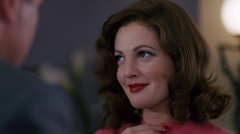 Movie still from “Grey Gardens” (2009), directed by Michael Sucsy – A beautiful woman with red lipstick looking to the side; Close Up shot, Over the shoulder angle