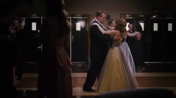 Movie still from “Grey Gardens” (2009), directed by Michael Sucsy – A man and a woman in formal wear dancing; Medium shot, Low angle