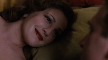 Movie still from “Grey Gardens” (2009), directed by Michael Sucsy – A person laying on a bed; Close Up shot, Over the shoulder angle