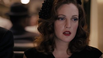 Movie still from “Grey Gardens” (2009), directed by Michael Sucsy – A person wearing a black dress; Close Up shot, Over the shoulder angle