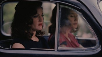 Movie still from “Grey Gardens” (2009), directed by Michael Sucsy – Two women are sitting in the back seat of a car; Medium shot, Over the shoulder angle