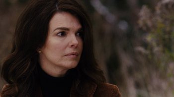 Movie still from “Grey Gardens” (2009), directed by Michael Sucsy – A person wearing a brown jacket; Close Up shot, Over the shoulder angle