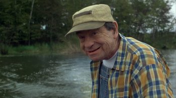 Movie still from “Grumpier Old Men” (1995), directed by Howard Deutch – An older man wearing a plaid shirt and a hat; Medium shot, Low angle